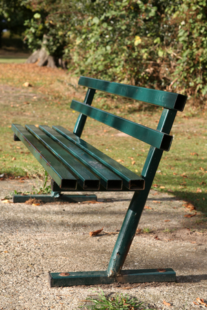 Green painted metal park seat, Marshalls Park, Braintree, Essex