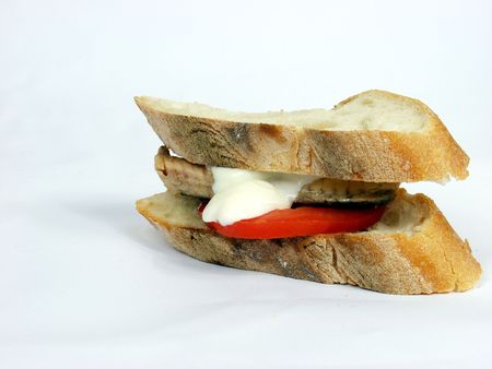 isolated piece of mackerel and tomato slice sandwich with mayonnaiseの写真素材