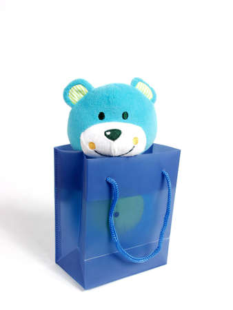 teddybear inside a blue bag for presentの写真素材