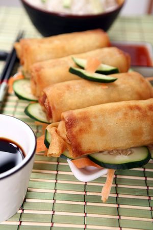Crispy Chinese egg rolls with soya sauce for dipping.の写真素材