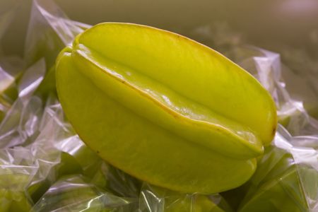 isolated tropycal fruit carambola on a fruitshopの写真素材