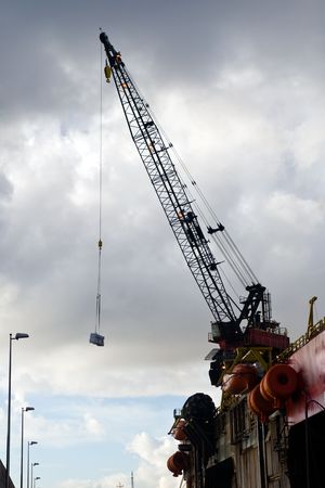 working crane of an oil rig in harbor