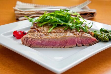 grilled beef steak with tomato slices and asparagusの写真素材