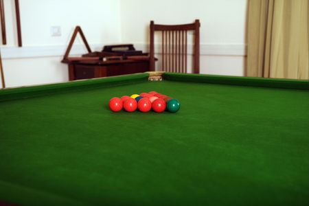 preparing the billard ball on green table