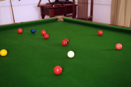 preparing the billard ball on green table