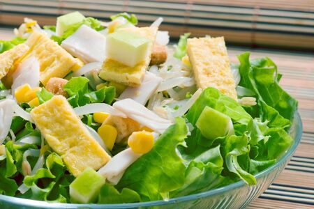 lettuce salad with sweet corn and turkey hamの写真素材