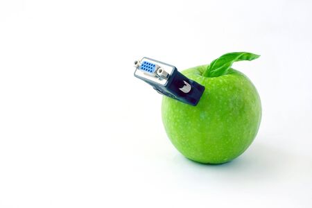 abstract green apple with monitor adapter on white backgroundの写真素材