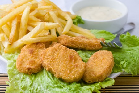 fried chicken nuggets with sauce for dipping and friesの写真素材
