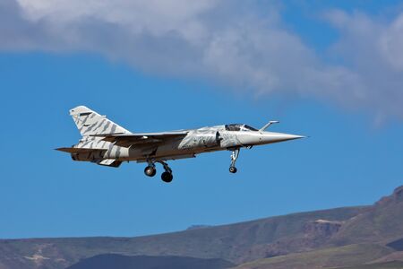 dassault mirage f1 airplane on blue sky dayの写真素材