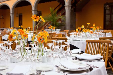 Table setting for a wedding or dinner event with flowersの写真素材