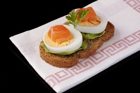 fresh salmon steak on toast bread and eggの写真素材