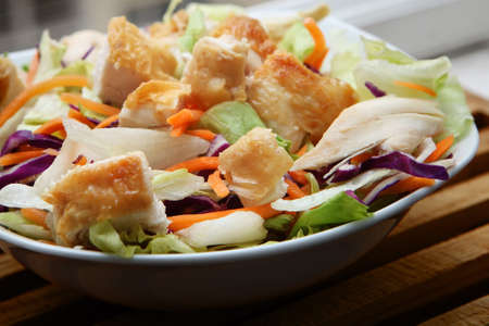 fresh and ready exquisite chicken salad on bowlの写真素材