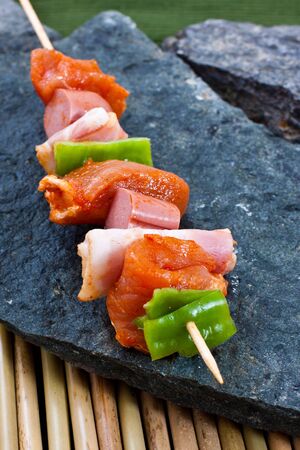 Raw meat on a skewer ready for grillの写真素材