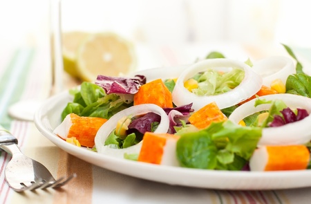 surimi salad with fresh corn on white dishの写真素材