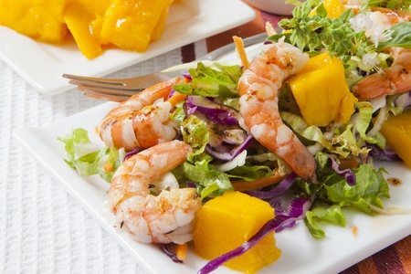 prawn salad with fresh mango fruit on trayの写真素材