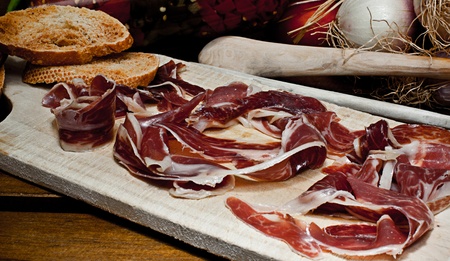 Spanish red ham table with grilled bread