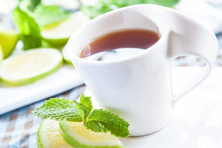a fresh cup of tea with mint and lemonの写真素材