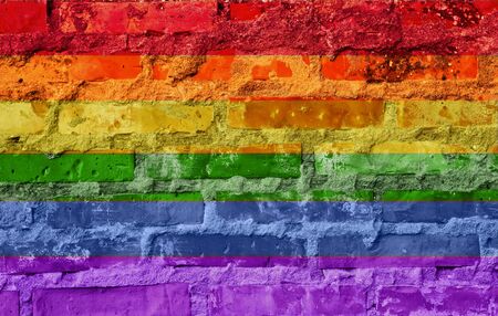 the Rainbow flag painted on a brick wallの写真素材
