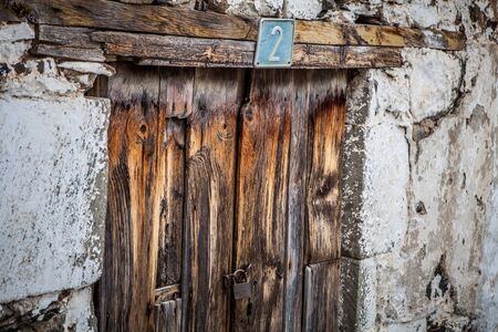 old wood small door on brown and grey colorsの写真素材