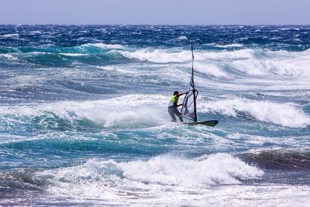 POZO IZQUIERDO, CANARY ISLANDS, GRAN CANARIA - JUL  11  A professional windsurfer competes at the International PWA Competition on JUL  09, 2011 in Pozo Izquierdo beach, Gran Canaria  This event is under PWA rules のeditorial素材