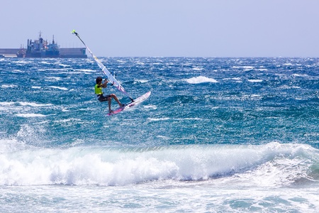 POZO IZQUIERDO, CANARY ISLANDS, GRAN CANARIA - JUL  11  A professional windsurfer competes at the International PWA Competition on JUL  09, 2011 in Pozo Izquierdo beach, Gran Canaria  This event is under PWA rules のeditorial素材