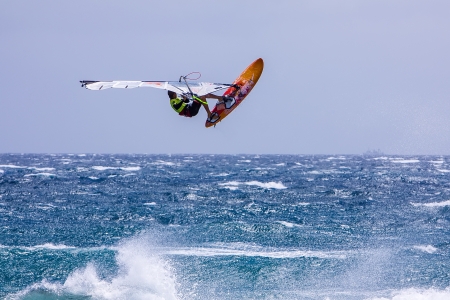 POZO IZQUIERDO, CANARY ISLANDS, GRAN CANARIA - JUL  11  A professional windsurfer competes at the International PWA Competition on JUL  09, 2011 in Pozo Izquierdo beach, Gran Canaria  This event is under PWA rules のeditorial素材