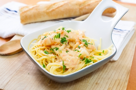 spaghetti with prawn and seafood sauce on bowlの写真素材