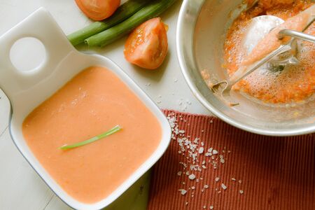 preparing spanish tomato soup called gazpacho on woodenの写真素材