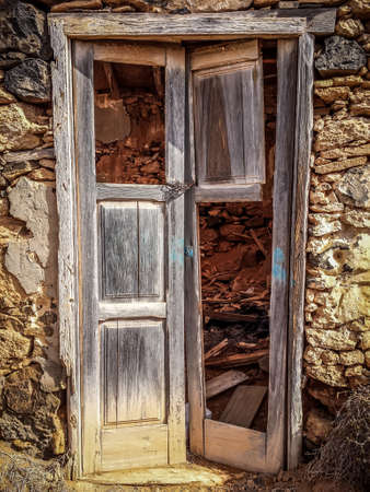 The old wooden door in an abandoned houseの写真素材
