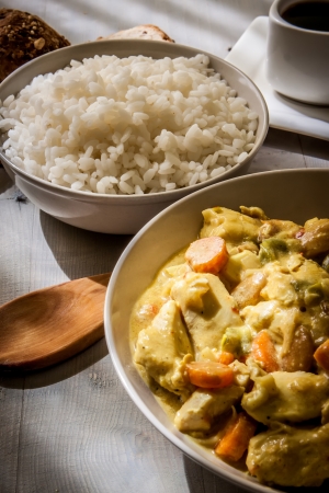 chicken curry with boiled basmaty rice on bowlの写真素材
