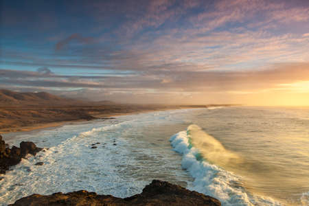el cotillo beach in fuerteventura island on sunsetの写真素材