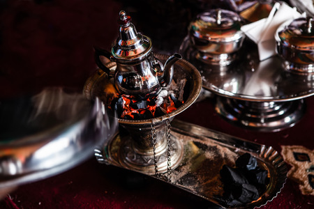 preparing and serving morocco tea in traditional glassesの写真素材