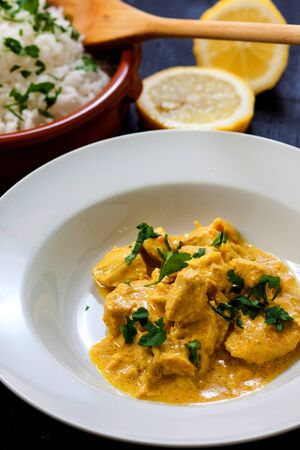 chicken curry with boiled rice and spicesの写真素材