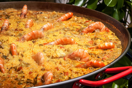 spanish rice with vegetables and shirmp also called paellaの写真素材