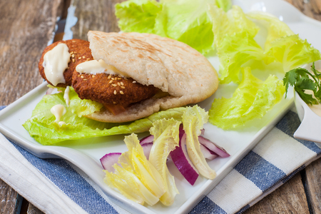pita bread with lebanese falafel and salad with sauceの写真素材