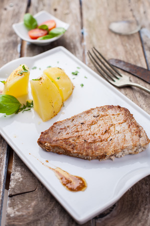 fresh tuna steak grilled served with potato and paprika sauceの写真素材