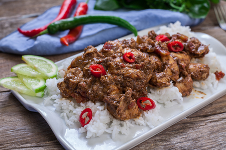 garam masala chicken curry style on pot with basmati riceの写真素材