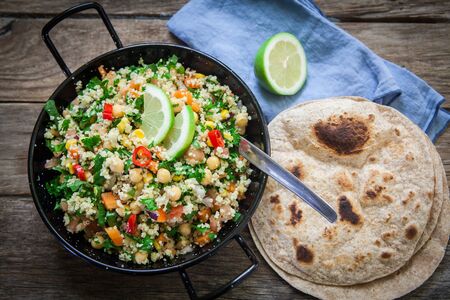 Fresh quinoa and cuscus salad on pot ready for eat