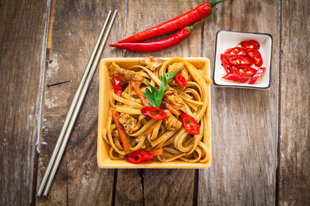 Chicken chow mein a popular oriental dish with noodles and vegetablesの写真素材