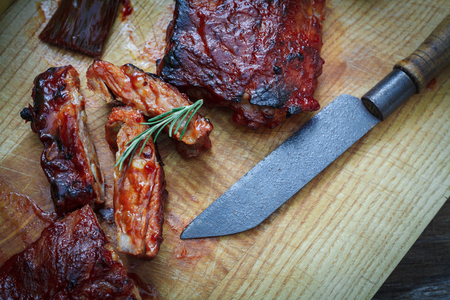 Homade pork bbq ribs with french fries on tableの写真素材