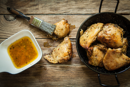chicken drumstick with spices and red chili peppersの写真素材