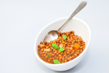 a bowl of homemade lentil soup with vegetablesの写真素材