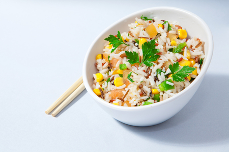 healthy asorted rice salad on white bowlの写真素材