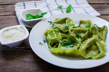 italian pasta tortelloni filled with ricotta cheese and spinachの写真素材