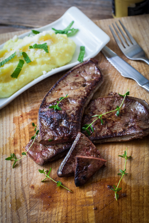 fresh veal liver with herbs and mashed potatoの写真素材