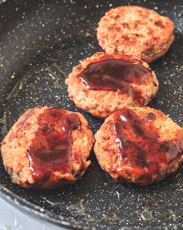 Homemade beef burger salisbury steak with sauce on panの写真素材