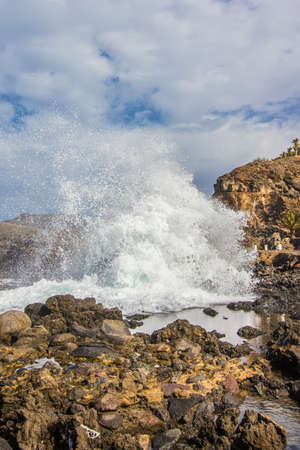 waves in a blue and green ocean near the coastの写真素材