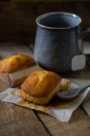 composition with a cup of black tea and two biscuitsの写真素材
