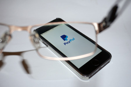 Samara, Russia - February 15, 2015: PayPal app open in the mobile phone Iphone 5s. Apple Corporation...