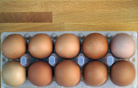 eggs in the package on a wooden table